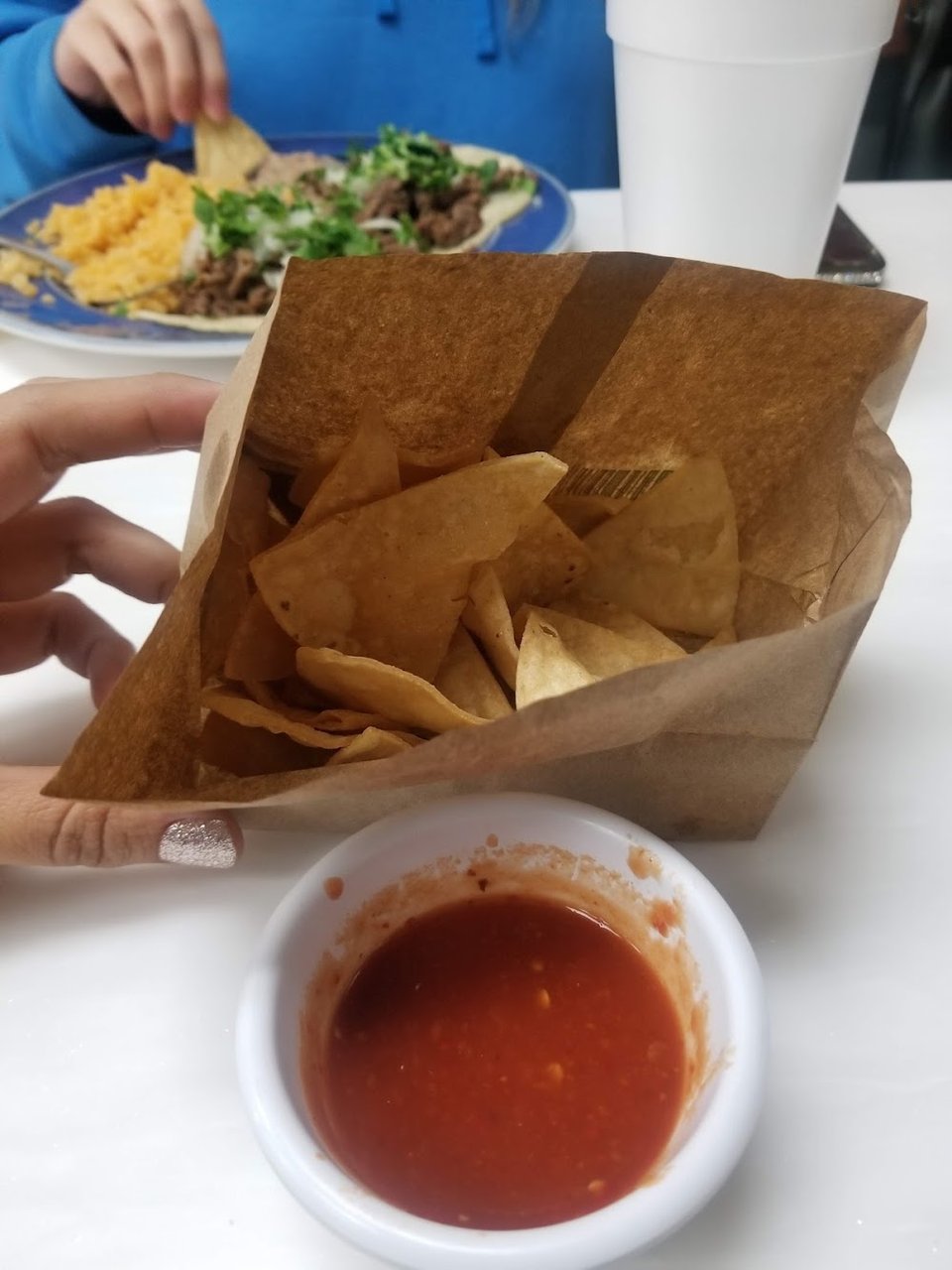 Printed menu with tacos and breakfast burritos
